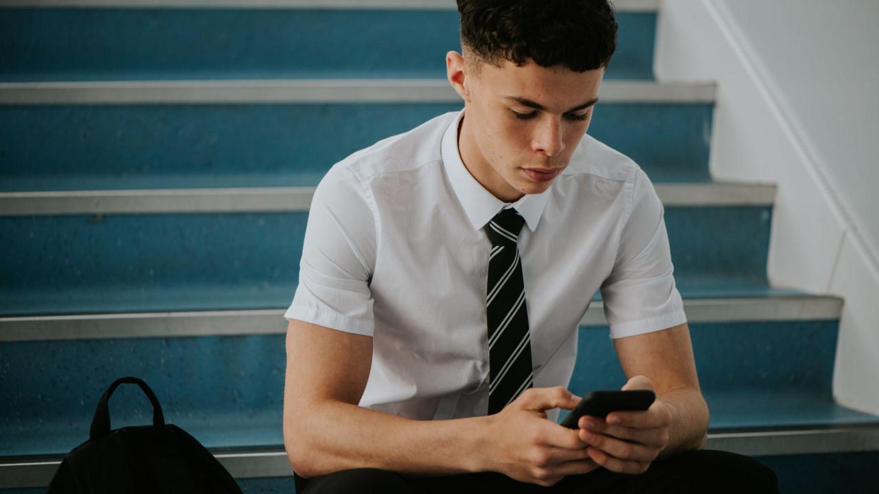 A smartphone ban in English schools is coming into force. What's changing?